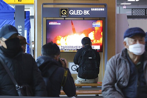 People watch a TV screen showing a file image of North Korea's missile launch during a news program at the Seoul Railway Station in Seoul, South Korea, Sunday, March 29, 2020. North Korea on Sunday fired two suspected ballistic missiles into the sea, South Korea said, calling it &quot;very inappropriate&quot; at a time when the world is battling the coronavirus pandemic.(AP Photo/Ahn Young-joon)