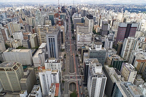 An aerial view of the almost empty Paulista Avenue, on the city's all important financial center, on the first day of quarantine to help stop the spread of the new coronavirus, in Sao Paulo, Brazil, Tuesday, March 24, 2020. (AP Photo/Andre Penner)