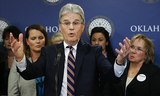 FILE - In this March 28, 2018 file photo, former U.S. Sen. Tom Coburn speaks at a news conference in Oklahoma City.  Coburn has died. He was 72. A cousin tells The Associated Press that he died early Saturday, March 28, 2020. Coburn had been diagnosed with prostate cancer years earlier. The Oklahoma Republican railed against federal earmarking and earned a reputation as a political maverick. (AP Photo/Sue Ogrocki, File)