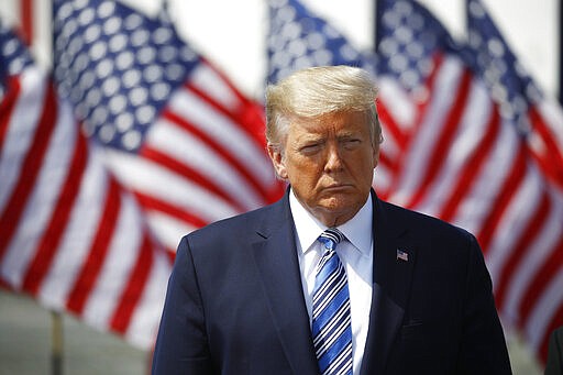 President Donald Trump arrives to speak in front of the U.S. Navy hospital ship USNS Comfort at Naval Station Norfolk in Norfolk, Va., Saturday, March 28, 2020. The ship is departing for New York to assist hospitals responding to the coronavirus outbreak. (AP Photo/Patrick Semansky)