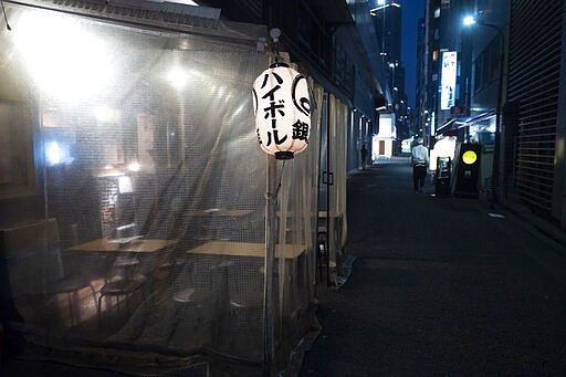 A lantern hangs outside an empty restaurant Saturday, March 28, 2020, in the Shimbashi section of Tokyo. okyo Gov. Yuriko Koike has repeatedly asked the city's 13 million residents to stay home this weekend, saying the capital is on the brink of an explosion in virus infections. (AP Photo/Jae C. Hong)