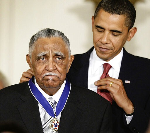 FILE - In this Aug. 12, 2009, file photo, President Barack Obama presents a 2009 Presidential Medal of Freedom to the Rev. Joseph E. Lowery n the East Room of the the White House in Washington. Lowery, a veteran civil rights leader who helped the Rev. Dr. Martin Luther King Jr. found the Southern Christian Leadership Conference and fought against racial discrimination, died Friday, March 27, 2020, a family statement said. He was 98. (AP Photo/J. Scott Applewhite, File)