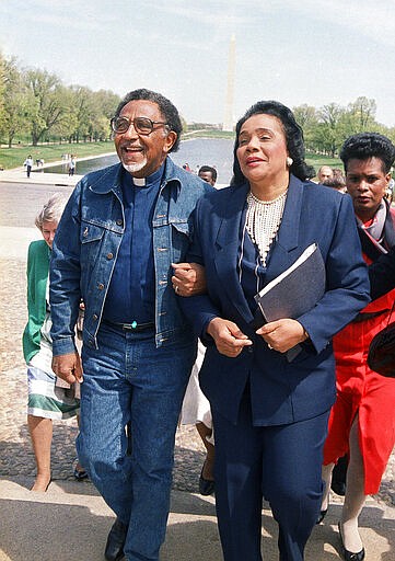 FILE - In this April 21, 1988, file photo, Coretta Scott King, widow of the Rev. Dr. Martin Luther King Jr., and the Rev. Joseph E. Lowery, president of the Southern Christian Leadership Conference, walk arm in arm after announcing plans for a rally during a news conference at the Lincoln Memorial in Washington. Lowery, a veteran civil rights leader who helped King Jr. found the SCLC and fought against racial discrimination, died Friday, March 27, 2020, a family statement said. He was 98. (AP Photo/Bob Daugherty, File)