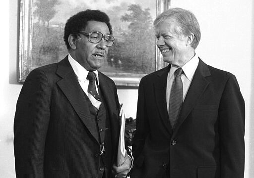 FILE - In this Oct. 23, 1980, file photo, President Jimmy Carter meets with the Rev. Joseph E. Lowery, president of the Southern Christian Leadership Conference, at the White House in Washington. Lowery, a veteran civil rights leader who helped the Rev. Dr. Martin Luther King Jr. found the SCLC and fought against racial discrimination, died Friday, March 27, 2029, a family statement said. He was 98. (AP Photo/Jim Wilson, File)