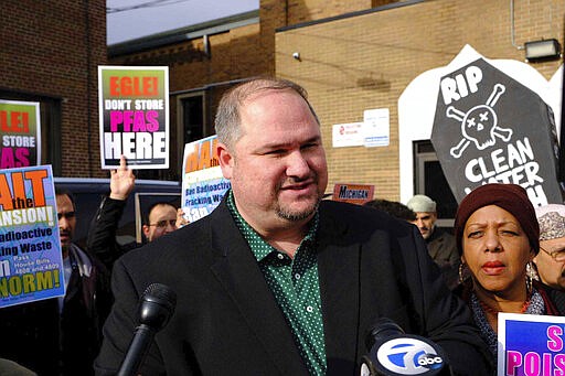 In this Dec. 27, 2019, photo, State Reps. Isaac Robinson and Cynthia A. Johnson, D-Detroit, protest with community members in Detroit over the expansion of a treatment center in Hamtramck. First-term Michigan State Rep. Robinson died Sunday, March 29, 2020, according to this mother, who said she suspects her son's death could be related to the coronavirus. He was 44. (Sarah Rahal/Detroit News via AP)