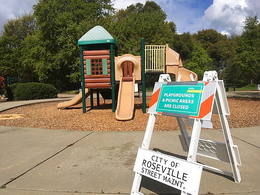 Closed playgrounds and picnic areas are seen closed amid the global coronavirus pandemic outbreak, in Roseville, Calif., on Sunday, March 29, 2020. Californians endured a weekend of stepped-up restrictions aimed at keeping them home as much as possible while hospitals and health officials scrambled Sunday to ready themselves for a week that could see the feared dramatic surge in coronavirus cases. The government's top infectious-disease expert warned Sunday that the coronavirus outbreak could kill 100,000 to 200,000 Americans as smoldering hotspots in nursing homes and a growing list of stricken cities heightened the sense of dread across the country. (AP Photo/Don Thompson)