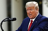Trump extends virus guidelines, braces US for big death toll