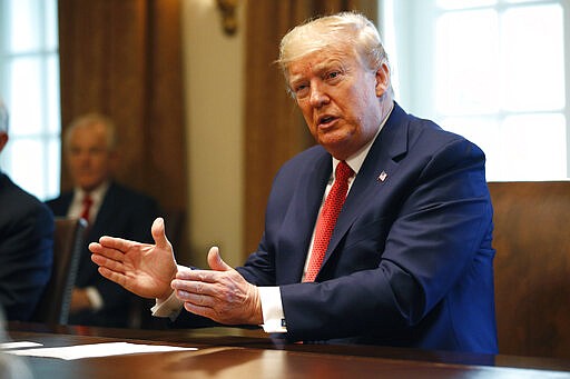 President Donald Trump speaks during a meeting with supply chain distributors in the Cabinet Room of the White House, Sunday, March 29, 2020, in Washington. (AP Photo/Patrick Semansky)