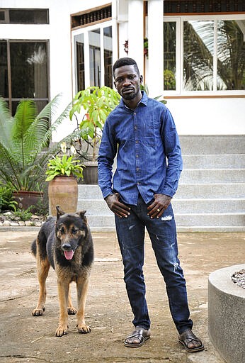 In this photo taken Friday, March 27, 2020, Ugandan musician, lawmaker and presidential aspirant Bobi Wine, whose real name is Kyagulanyi Ssentamu, speaks to The Associated Press in Kampala, Uganda. Wine, who released a song in March 2020 urging Africa's people to wash their hands to stop the spread of the new coronavirus, is criticizing African governments for not maintaining better health care systems for the continent's 1.3 billion people while investing in weapons and &quot;curtailing the voices of the people&quot;. (AP Photo/Ronald Kabuubi)