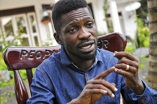 In this photo taken Friday, March 27, 2020, Ugandan musician, lawmaker and presidential aspirant Bobi Wine, whose real name is Kyagulanyi Ssentamu, speaks to The Associated Press in Kampala, Uganda. Wine, who released a song in March 2020 urging Africa's people to wash their hands to stop the spread of the new coronavirus, is criticizing African governments for not maintaining better health care systems for the continent's 1.3 billion people while investing in weapons and &quot;curtailing the voices of the people&quot;. (AP Photo/Ronald Kabuubi)