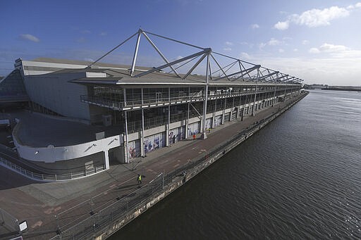 A general view of the Excel exhibition centre which is being converted into a temporary hospital - the NHS Nightingale hospital, in London, Sunday, March 29, 2020. The new coronavirus causes mild or moderate symptoms for most people, but for some, especially older adults and people with existing health problems, it can cause more severe illness or death. (AP Photo/Alberto Pezzali)