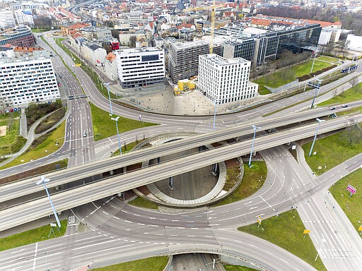 Only occasionally do cars drive over the city's largest traffic junction, the Riebeckplatz in Halle, Germany, March 29, 2020.  There are exit restrictions throughout Germany due to the coronavirus. (Jan Woitas/dpa via AP)