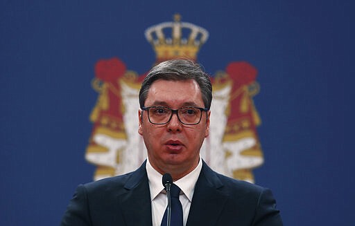 In this March 15, 2020, photo, Serbian President Aleksandar Vucic speaks during a news conference in Belgrade, Serbia. Since declaring nationwide state of emergency Vucic has suspended parliament, giving him widespread powers such as closing borders and introducing a 12-hour curfew. (AP Photo/Darko Vojinovic)