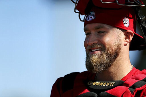 Cincinnati Reds catcher Tucker Barnhart (16) smiles following a bullpen session during spring training baseball, Friday, Feb. 14, 2020, at the Cincinnati Reds Spring Training Facility in Goodyear, Ariz. (Kareem Elgazzar/The Cincinnati Enquirer via AP)