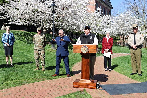 Maryland Gov. Larry Hogan announces a &quot;stay-at-home&quot; directive during a news conference on Monday, March 30, 2020 in Annapolis, Md. Hogan said no Maryland resident should be leaving home unless it is for an essential job or for an essential reason such as obtaining food, medicine or urgent medical attention. The order was set to go into effect at 8 p.m. Monday. (AP Photo/Brian Witte)