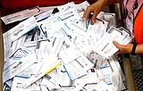 How will we vote? Outbreak revives debate on mail-in ballots