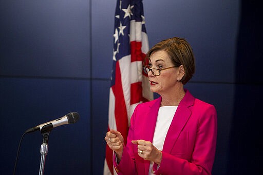 Iowa Governor Kim Reynolds speaks to the press during a news conference on Sunday, March 29, 2020, about the coronavirus COVID-19 and the state's response from the State Emergency Operation Center in Johnston, Iowa. (Kelsey Kremer/The Des Moines Register via AP, Pool)