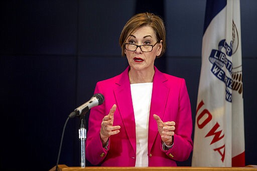 Iowa Governor Kim Reynolds speaks to the press during a news conference on Sunday, March 29, 2020, about the coronavirus COVID-19 and the state's response from the State Emergency Operation Center in Johnston, Iowa. (Kelsey Kremer/The Des Moines Register via AP, Pool)