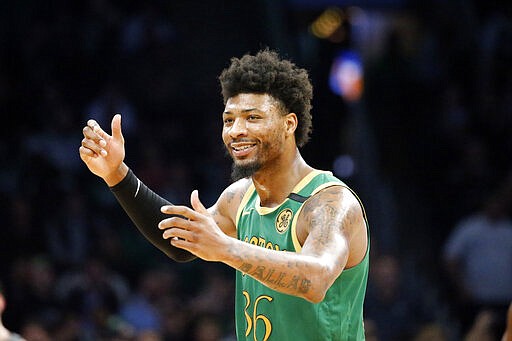 FILE - In this March 3, 2020, file photo, Boston Celtics guard Marcus Smart (36) reacts to a call during the second half of an NBA basketball game against the Brooklyn Nets in Boston. Celtics guard Marcus Smart says he has been cleared by medical officials after testing positive for the new coronavirus earlier this month. In a message posted late Sunday, March 29, 2020, on Twitter, Smart says he was informed of the news Friday by the Massachusetts Department of Health. He thanked everyone for their support. &#147;Stay safe and stay together _ apart!&#148; Smart wrote.(AP Photo/Mary Schwalm, File)