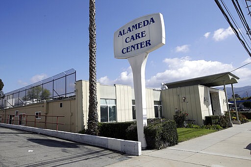 The exterior view of the Alameda Care Center is seen Sunday, March 29, 2020, in Burbank, Calif. Vernon Robinson, a resident of Alameda Care Center, died Thursday in the hospital after his wife, Willa, said he had tested positive for COVID-19. The 81-year old had Alzheimer's disease and underlying hear and lung conditions. (AP Photo/Marcio Jose Sanchez)