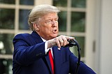 Trump defends extending virus guidelines as spread continues