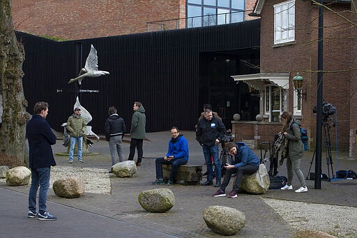 Journalists wait outside the Singer Museum in Laren, Netherlands, Monday March 30, 2020, where a Van Gogh painting was stolen. The Dutch museum that is currently closed to prevent the spread of the coronavirus says a painting by the Dutch master titled &quot;Spring Garden&quot; was stolen in a smash-and-grab raid overnight. (AP Photo/Peter Dejong)