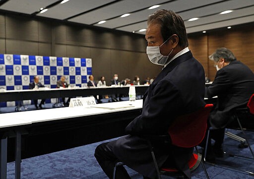 Haruyuki Takahashi, executive board member of the Tokyo Organizing Committee of the Olympic and Paralympic Games attends the Tokyo 2020 Executive Board Meeting in Tokyo, Japan Monday, March 30, 2020. Tokyo Olympic President Yoshiro Mori said Monday he expects to talk with IOC President Thomas Bach this week about potential dates and other details for the rescheduled games next year.  (Issei Kato/Pool Photo via AP)