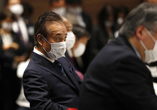 Haruyuki Takahashi, executive board member of the Tokyo Organizing Committee of the Olympic and Paralympic Games attends the Tokyo 2020 Executive Board Meeting in Tokyo, Japan Monday, March 30, 2020. Tokyo Olympic President Yoshiro Mori said Monday he expects to talk with IOC President Thomas Bach this week about potential dates and other details for the rescheduled games next year.  (Issei Kato/Pool Photo via AP)