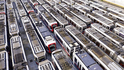 Muni light rail cars rest dormant at a Geneva Ave. storage and maintenance facility on Monday, March 30, 2020, in San Francisco. On Monday, San Francisco Municipal Transportation Agency (SFMTA) indefinitely suspended all light rail service due to plummeting readership caused by coronavirus shelter-in-place orders. (AP Photo/Noah Berger)