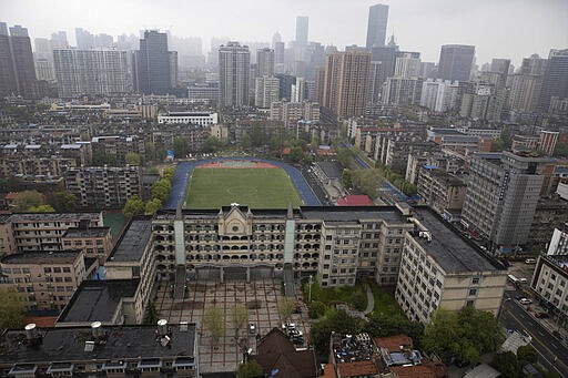 A view of the city of Wuhan taken from a quarantine hotel in central China's Hubei province on Monday, March 30, 2020. Shopkeepers in the city at the center of China's virus outbreak were reopening Monday but customers were scarce after authorities lifted more of the anti-virus controls that kept tens of millions of people at home for two months. (AP Photo/Ng Han Guan)