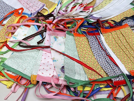 Completed health masks made at the Children's Theatre in Eau Claire, Wis., on March 24, 2020. Local theater members have shifted their focus from creating costumes to making face masks in an effort to combat COVID-19. (Dan Reiland/The Eau Claire Leader-Telegram via AP)