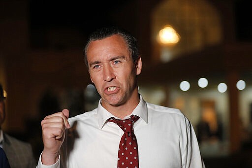 Pastor Tony Spell speaks to media after holding an evening service at Life Tabernacle Church in Central, La., Tuesday, March 31, 2020. Spell is facing misdemeanor charges for holding services previously despite a ban on gatherings amid the coronavirus pandemic. (AP Photo/Gerald Herbert)