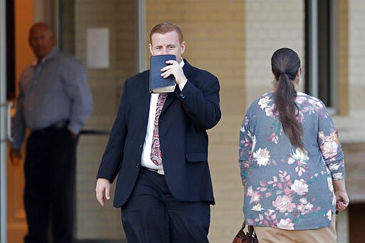 Congregants arrive for evening service at the Life Tabernacle Church in Central, La., Tuesday, March 31, 2020. Pastor Tony Spell held services despite being charged with misdemeanors today, for holding services against Gov. John Bel Edwards shelter-in-place order due to the new coronavirus pandemic. (AP Photo/Gerald Herbert)