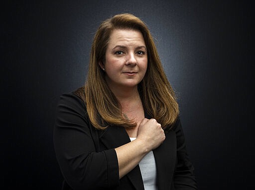 This March 16, 2020 photo shows event producer Heather Hope-Allison posing for a portrait in Los Angeles. Earlier this month, Hope-Allison and her husband, Steve were putting together the schedule for the ninth season of Street Food Cinema, a six-month series of events in the Los Angeles area featuring film indoor and outdoor screenings, food trucks and musical acts. But when Los Angeles Mayor Eric Garcetti announced a citywide &quot;Safer At Home&quot; order, shutting down all nonessential businesses due to the coronavirus, it became unclear whether she would be hosting any kind of season at all. (Photo by Willy Sanjuan/Invision/AP)