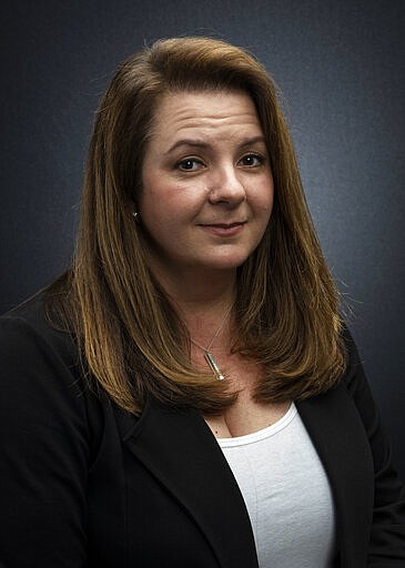 This March 16, 2020 photo shows event producer Heather Hope-Allison posing for a portrait in Los Angeles. Earlier this month, Hope-Allison and her husband, Steve were putting together the schedule for the ninth season of Street Food Cinema, a six-month series of events in the Los Angeles area featuring film indoor and outdoor screenings, food trucks and musical acts. But when Los Angeles Mayor Eric Garcetti announced a citywide &quot;Safer At Home&quot; order, shutting down all nonessential businesses due to the coronavirus, it became unclear whether she would be hosting any kind of season at all. (Photo by Willy Sanjuan/Invision/AP)