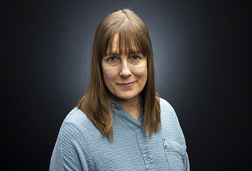 This March 16, 2020 photo shows TV producer and film director Leslie Thomas posing for a portrait in Los Angeles. On March 14, Thomas was one step closer to the Hollywood dream. Tickets were sold out for the 250-seat theater set to screen her indie comedy &quot;Honesty Weekend&quot; at the Pasadena Film Festival. Thomas said only 30 to 35 people showed up because they were terrified of the coronavirus. 
A day later, the Los Angeles mayor ordered cinemas closed in response to the coronavirus outbreak. (Photo by Willy Sanjuan/Invision/AP)