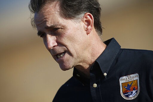 FILE - In this Oct. 5, 2015, file photo, Dan Ashe, then-director of the U.S. Fish and Wildlife Service, talks following an animal release at the Rocky Mountain Arsenal National Wildlife Refuge in Commerce City, Colo. Former U.S. Fish and Wildlife Service Director Ashe told The Associated Press that the Migratory Bird Treaty Act's threat of prosecution served as &quot;a brake on industry&quot; that had saved probably billions of birds. (AP Photo/David Zalubowski, File)