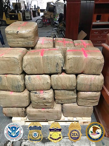 In this photo released Tuesday, March 31, 2020, by the San Diego Tunnel Task Force, Department of Homeland Security, a large haul of drugs that were seized in a cross-border tunnel running from warehouses in Tijuana, Mexico to San Diego are displayed in San Diego.  (San Diego Tunnel Task Force/Department of Homeland Security via AP)