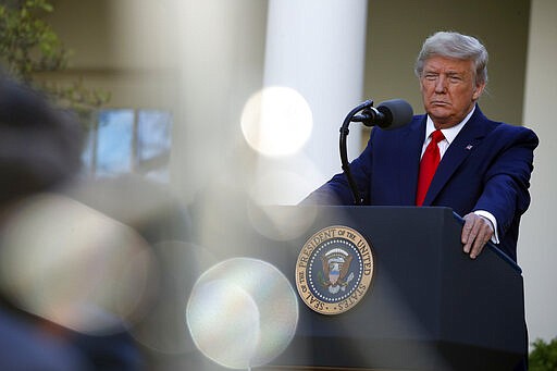 President Donald Trump listens to a question from a reporter as he speaks about the coronavirus in the Rose Garden of the White House, Monday, March 30, 2020, in Washington. (AP Photo/Alex Brandon)