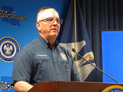 Gov. John Bel Edwards speaks to reporters about coronavirus cases in Louisiana on Monday, March 30, 2020, in Baton Rouge, La. Edwards said that he will extend Louisiana's &quot;stay at home&quot; order through the end of April, in line with President Donald Trump's most recent guidance. (AP Photo/Melinda Deslatte)