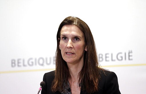 Belgium's Prime Minister Sophie Wilmes speaks during a media conference after a meeting of the National Safety Council in Brussels, Thursday, March 12, 2020. Belgium will close schools, restaurants and bars as of Friday, in an effort to contain the spread of the coronavirus. For most people, the new coronavirus causes only mild or moderate symptoms, such as fever and cough. For some, especially older adults and people with existing health problems, it can cause more severe illness, including pneumonia. (AP Photo)