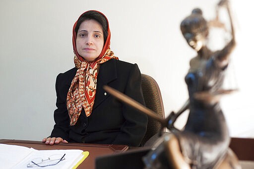 FILE - In this Nov. 1, 2008 file photo, Iranian human rights lawyer Nasrin Sotoudeh, poses for a photograph in her office in Tehran, Iran. Sotoudeh is jailed in Iran&#146;s most feared prison Evin prison. In some cells in Iran, Syria and other countries in the Middle East, prisoners are crammed in by the dozens, with little access to hygiene or medical care. So if one infection gets in, the novel coronavirus could run rampant. The virus causes mild or moderate symptoms for most people, but for some, especially older adults and people with existing health problems, it can cause more severe illness or death. (AP Photo/Arash Ashourinia, File)