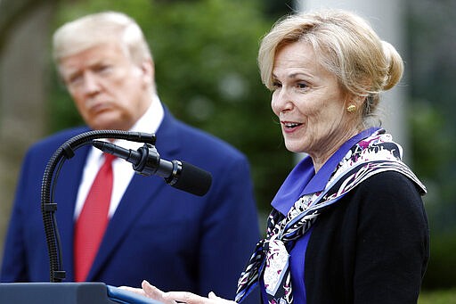 Dr. Deborah Birx, White House coronavirus response coordinator, speaks during a coronavirus task force briefing in the Rose Garden of the White House, Sunday, March 29, 2020, in Washington, as President Donald Trump listens. (AP Photo/Patrick Semansky)