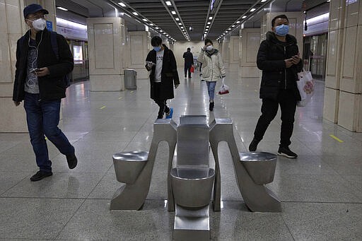Residents walk through a subway station in Wuhan in central China's Wuhan province on Wednesday, April 1, 2020. Skepticism about China&#146;s reported coronavirus cases and deaths has swirled throughout the crisis, fueled by official efforts to quash bad news in the early days and a general distrust of the government. In any country, getting a complete picture of the infections amid the fog of war is virtually impossible. (AP Photo/Ng Han Guan)