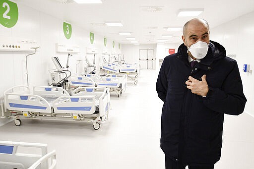 Director of Milan&#146;s Polyclinic hospital Ezio Belleri gives a tour to the media of the newly built Ospedalefieramilano, in Milan, Italy, Tuesday, March 331, 2020. Italian officials have unveiled a 200-bed intensive care field hospital at the Milan fairgrounds to help relieve the pressure on northern Italy&#146;s overwhelmed health care system from the coronavirus pandemic. The new coronavirus causes mild or moderate symptoms for most people, but for some, especially older adults and people with existing health problems, it can cause more severe illness or death. (Gian Mattia D'Alberto/LaPresse via AP)