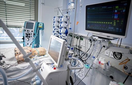 In this March 26, 2020 photo, a dummy doll lies on a bed of the newly opened intensive care unit of the Vivantes Humboldt Clinic in the Reinickendorf district in Berlin, Germany. Labs were quick to ramp up their testing capacity and now experts say up to 500,000 tests can be conducted in Germany per week. That quick work, coupled with the country's large number of intensive care unit beds and its early implementation of social distancing measures, could be behind Germany's relatively low death toll. (Kay Nietfeld/dpa via AP)