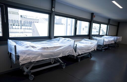 In this March 26 2020, photo, hospital beds stand in front of the newly opened intensive care unit of the Vivantes Humboldt Clinic in the Reinickendorf district in Berlin Germany. Labs were quick to ramp up their testing capacity and now experts say up to 500,000 tests can be conducted in Germany per week. That quick work, coupled with the country's large number of intensive care unit beds and its early implementation of social distancing measures, could be behind Germany's relatively low death toll. (Kay Nietfeld/dpa via AP)