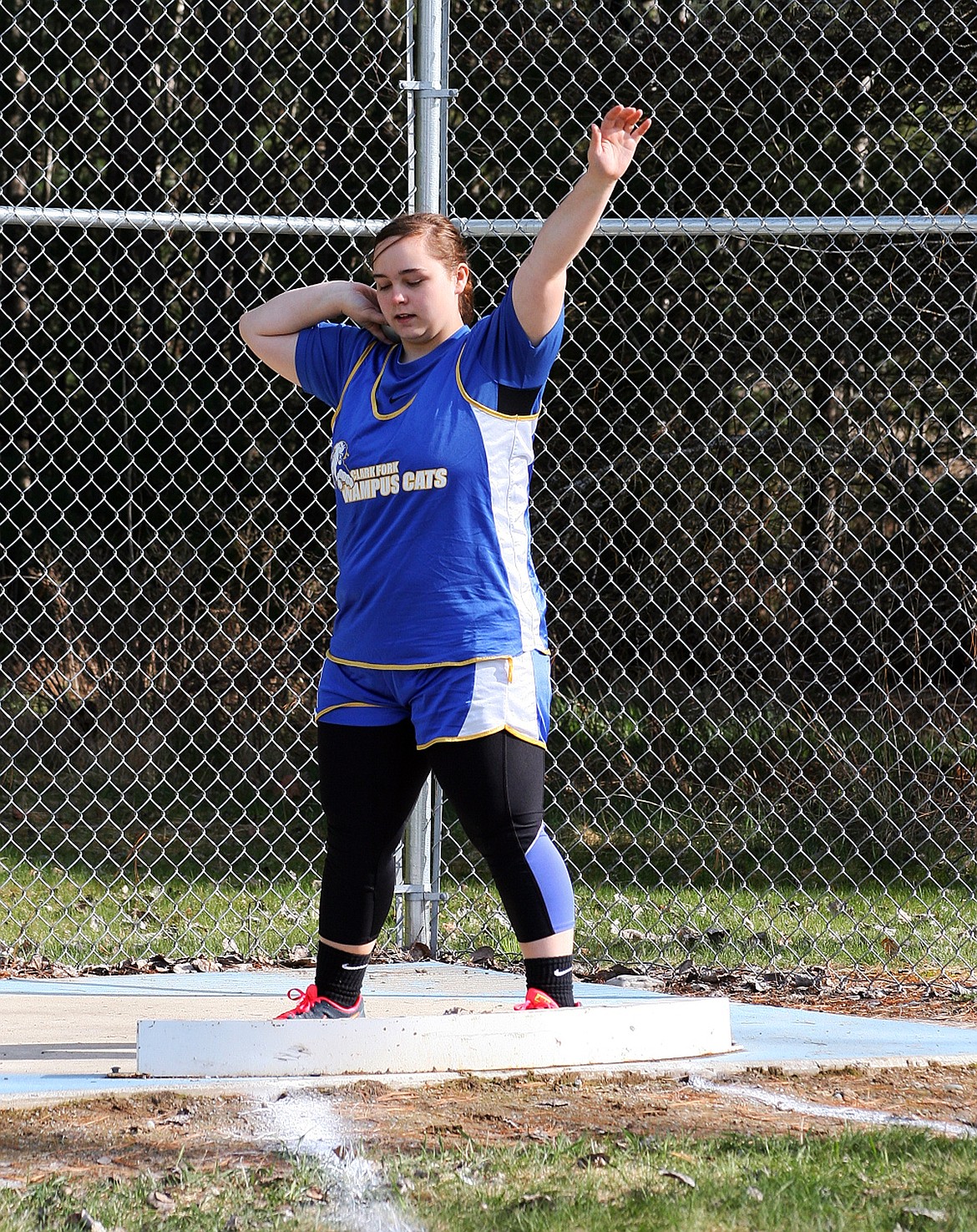 &#151;Photo by ERIC PLUMMER
Junior Nona Young hopes to make it to state this season in the shot put.