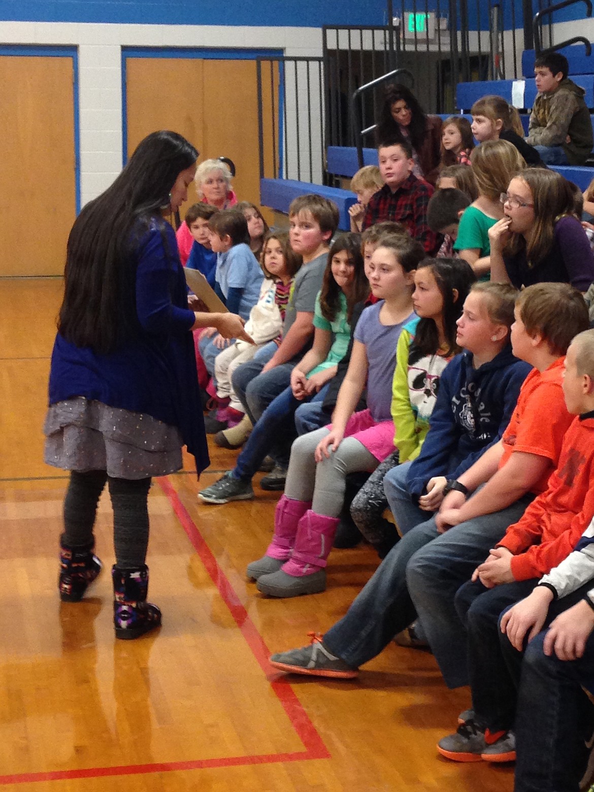 &#151;Photo courtesy IDAHO MYTHWEAVER
Kalispel tribal member Kayleen Sherwood explains a display she brought to show Priest River Elementary students in December 2015 visit to the school.