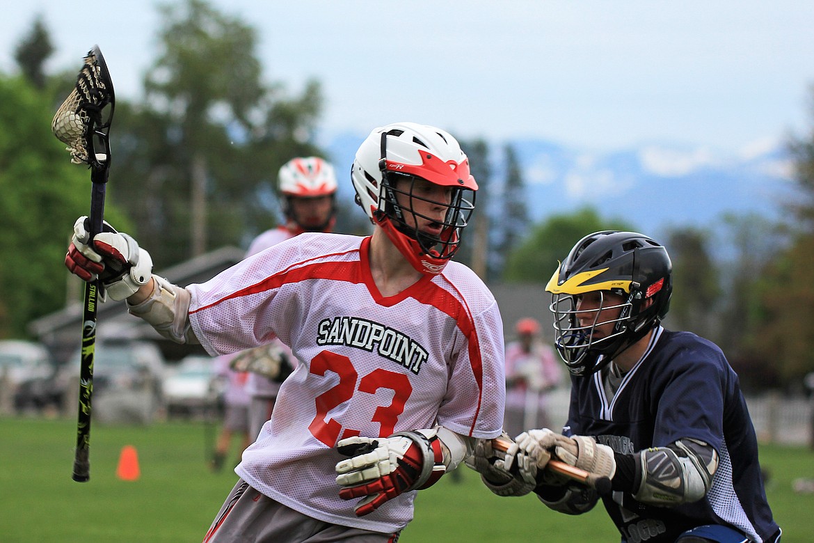 &#151;Photo by MICHAEL NUTT
Garrett Pierce, left, erupted for four goals to lead the Cutthroat high school team to a 6-4 league win over Logos recently. Brayden Demko and Joe Shauwecker each added a goal for the Cutthroat, who avenged an 8-7 loss to the Knights in Moscow earlier this season. The Cutthroat will play Moscow on Senior Night this Saturday, at 5 p.m. at War Memorial Stadium.